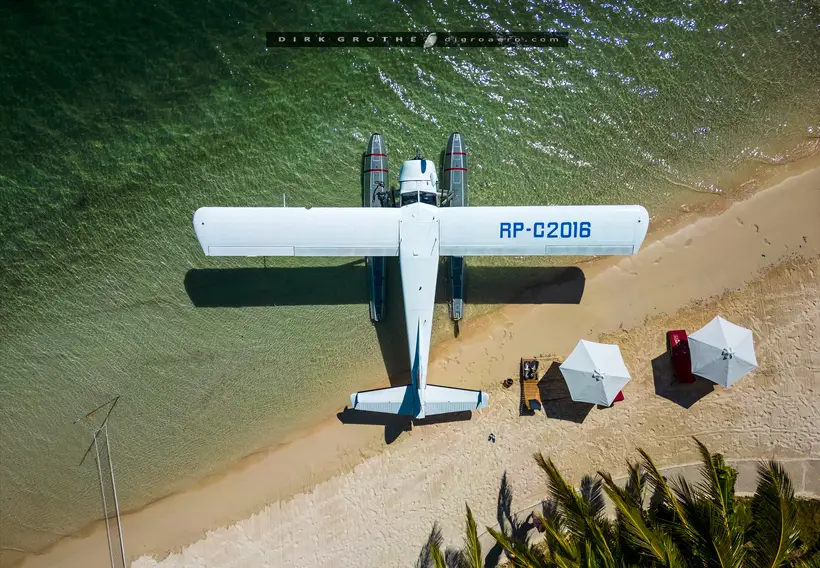 Drone view straight down on the Beaver RP-C2016 parked on its floats at a white beach